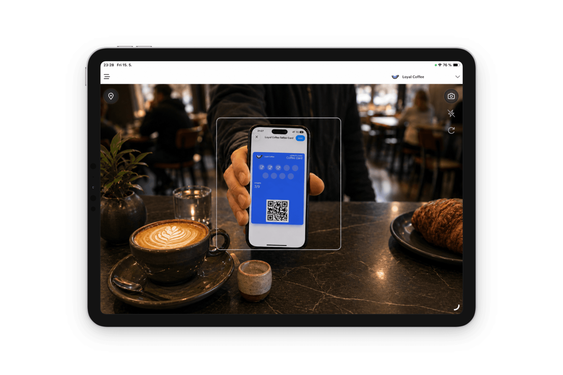 Stampit Partners app on an iPad scanning a customer's wallet pass on a phone